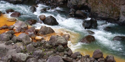 a river in Costa Rica tinted yellow by sulfur