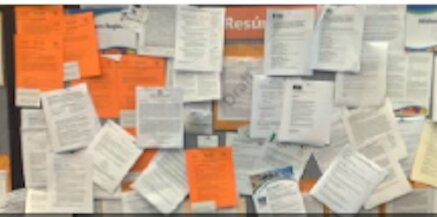 A board with job postings pinned on