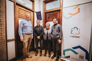 A group of people posing for a photo in the new I-GUIDE labratory.