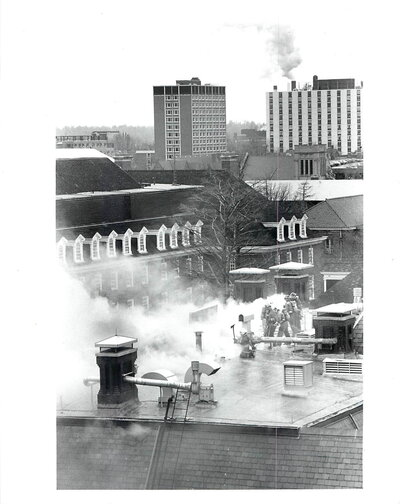 Firefighters on the roof of the Natural History Building fighting the fire in 1991.