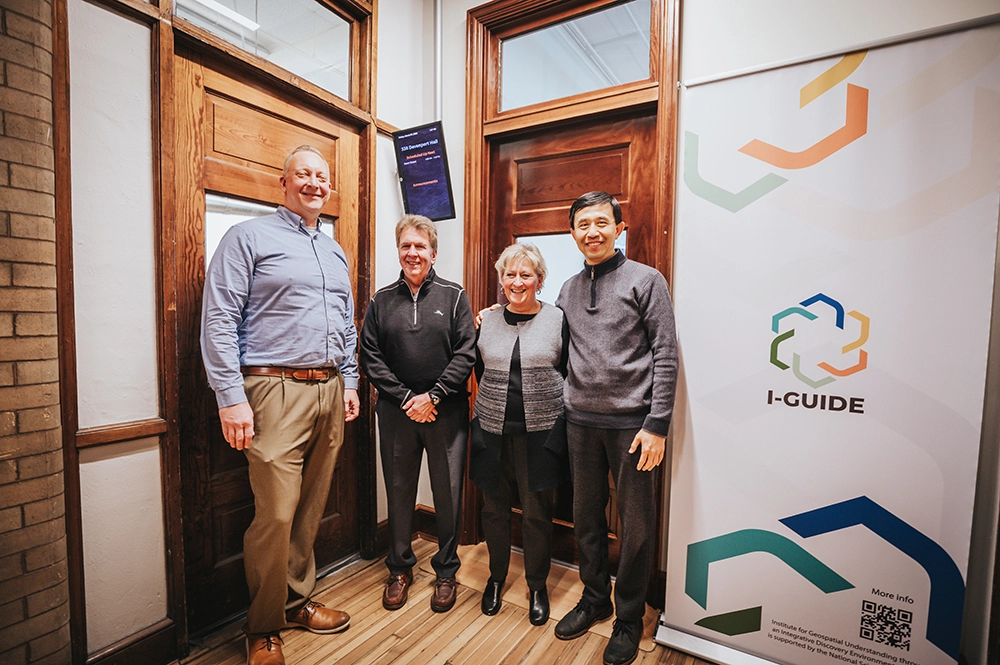 A group of people posing for a photo in the new I-GUIDE labratory.