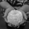 Maria Natividad Garay holds a hailstone she recovered outside her home in Villa Carlos Paz, Argentina. Mitch Dobrowner for The New York Times